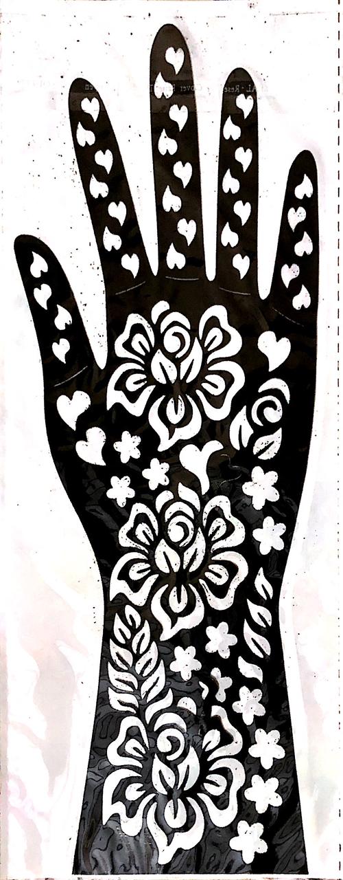 Black hand with white floral and heart designs on a white background