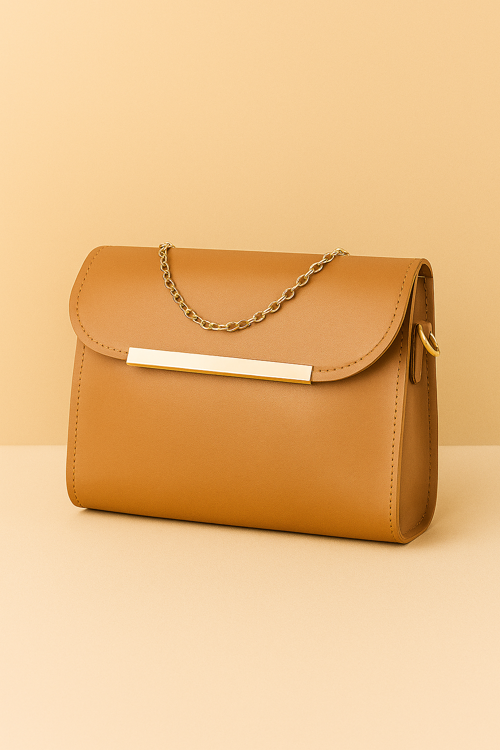Tan handbag with a chain detail on a beige background