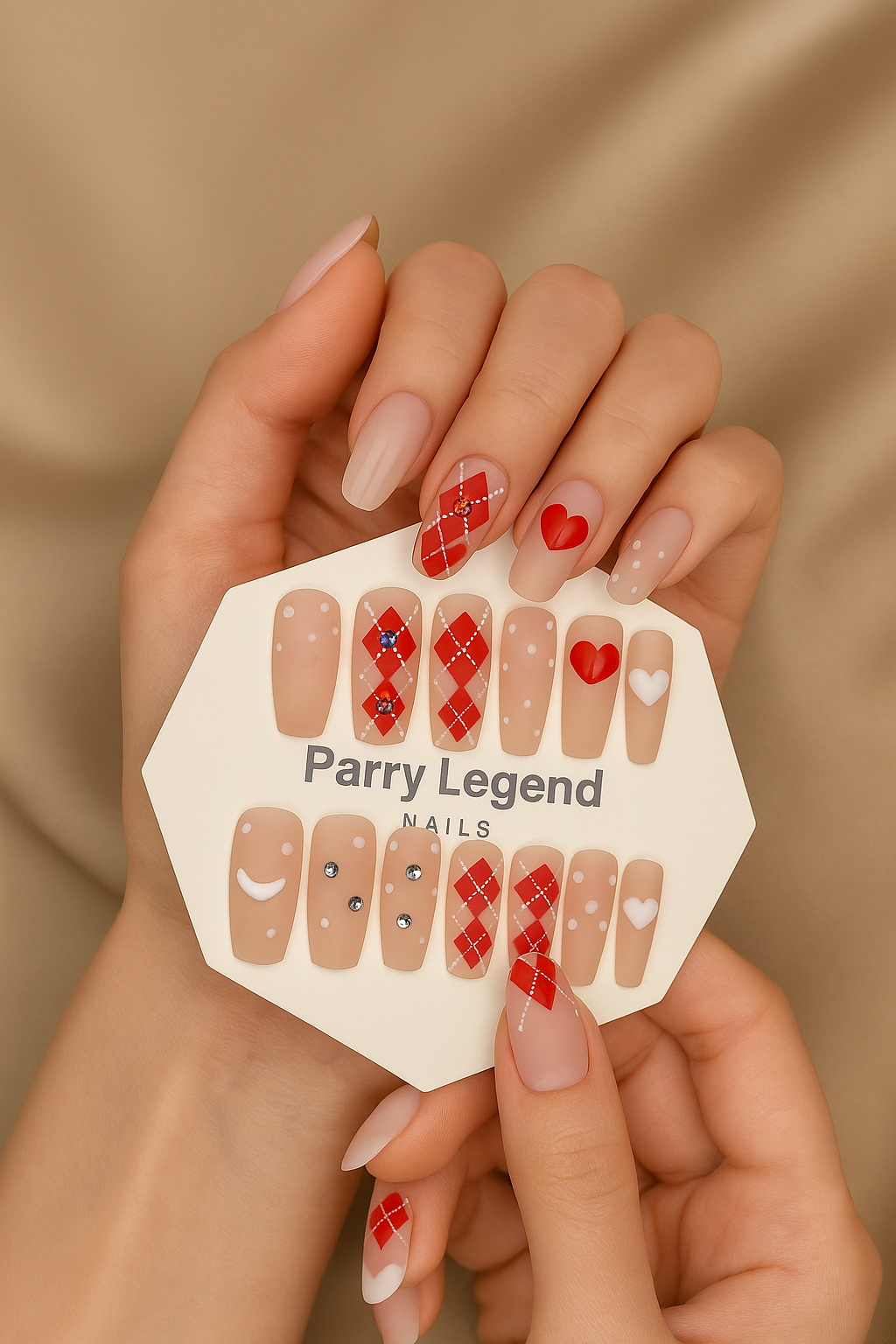 Hand holding a Parry Legend nail art design sheet with various nail art designs on a beige background.