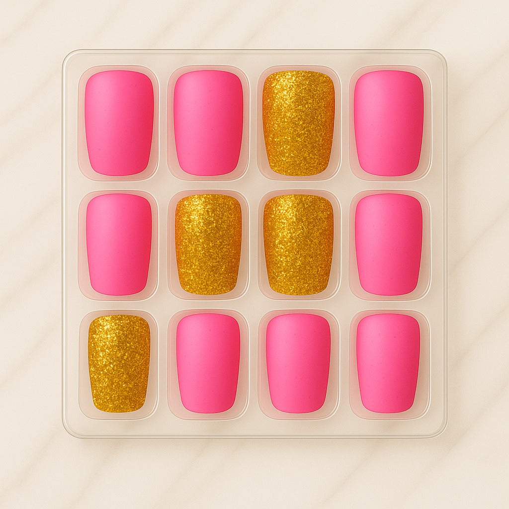 Set of pink and gold nail polish samples in a clear plastic tray on a beige background