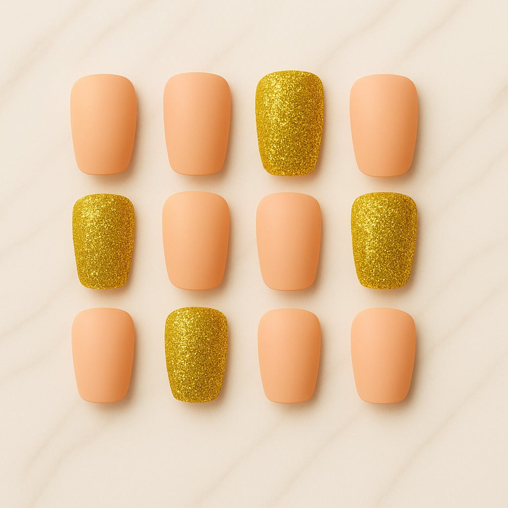 Nail art design with pink and gold glittery nails on a light background